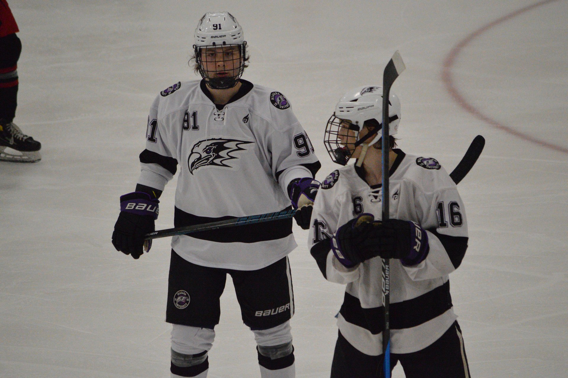 Derwin Hauser and Benji preparing to line up for a faceoff