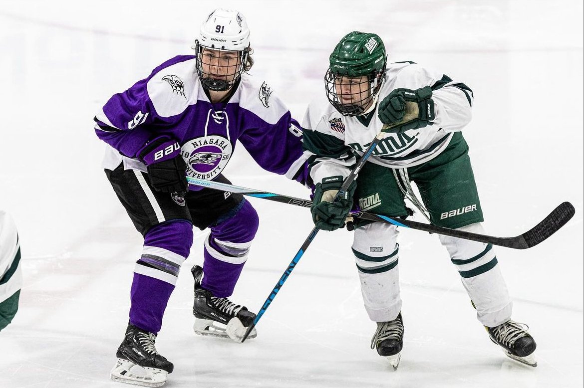 Derwin Hauser lining up for a faceoff against a Farmingdale State winger