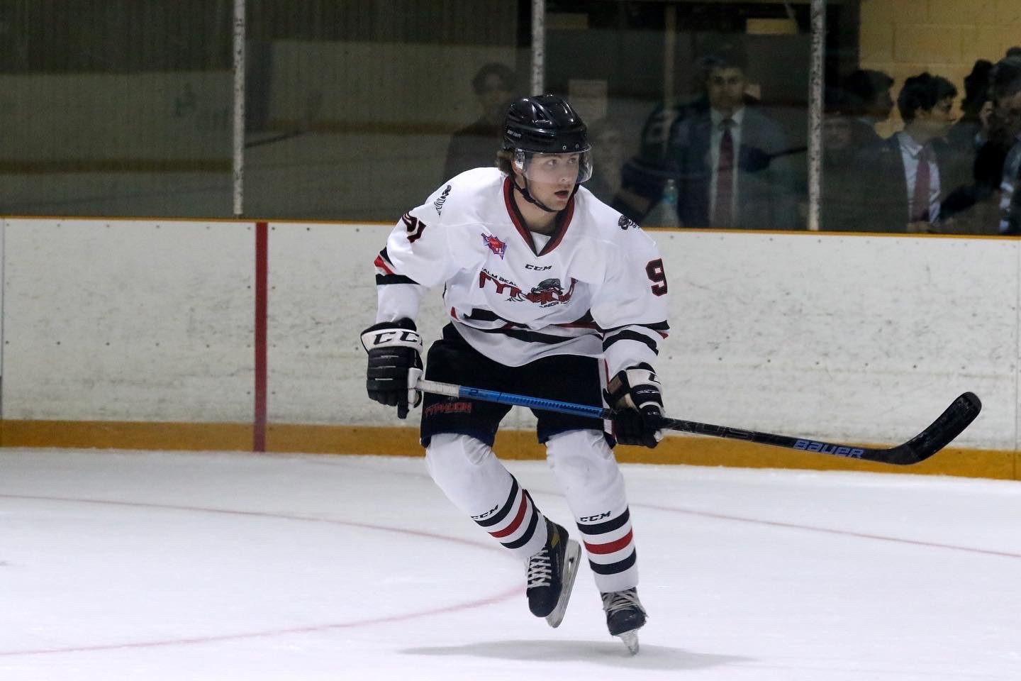 Derwin Hauser skating up the ice during a game
